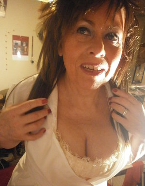 18 year old female Doris G slips off her underwear to pose naked on her bed